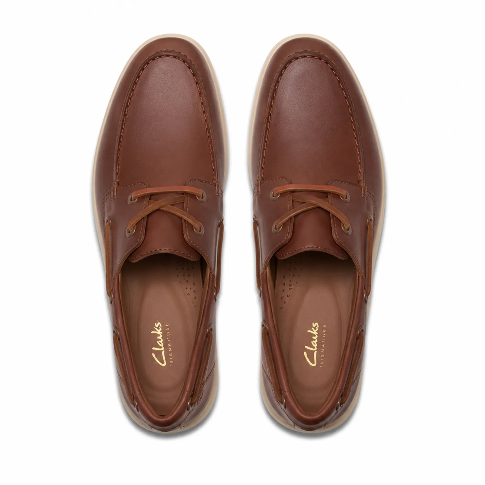 Side view of Clarks Torford Boat men's tan leather shoes with durable rubber sole