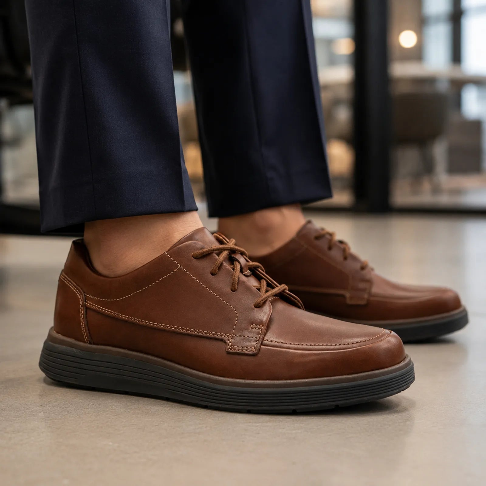 Brown leather lace-up business shoes with textured panel and low sole