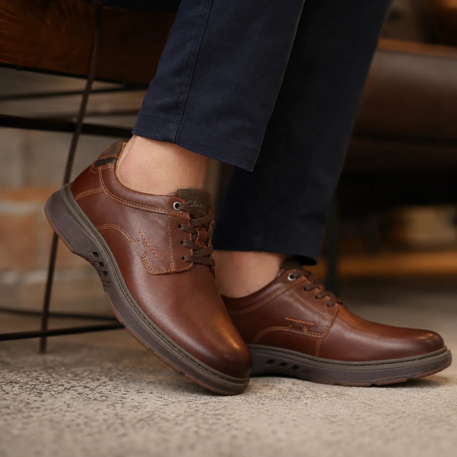 Men's brown leather lace-up business shoes with rubber sole, close view