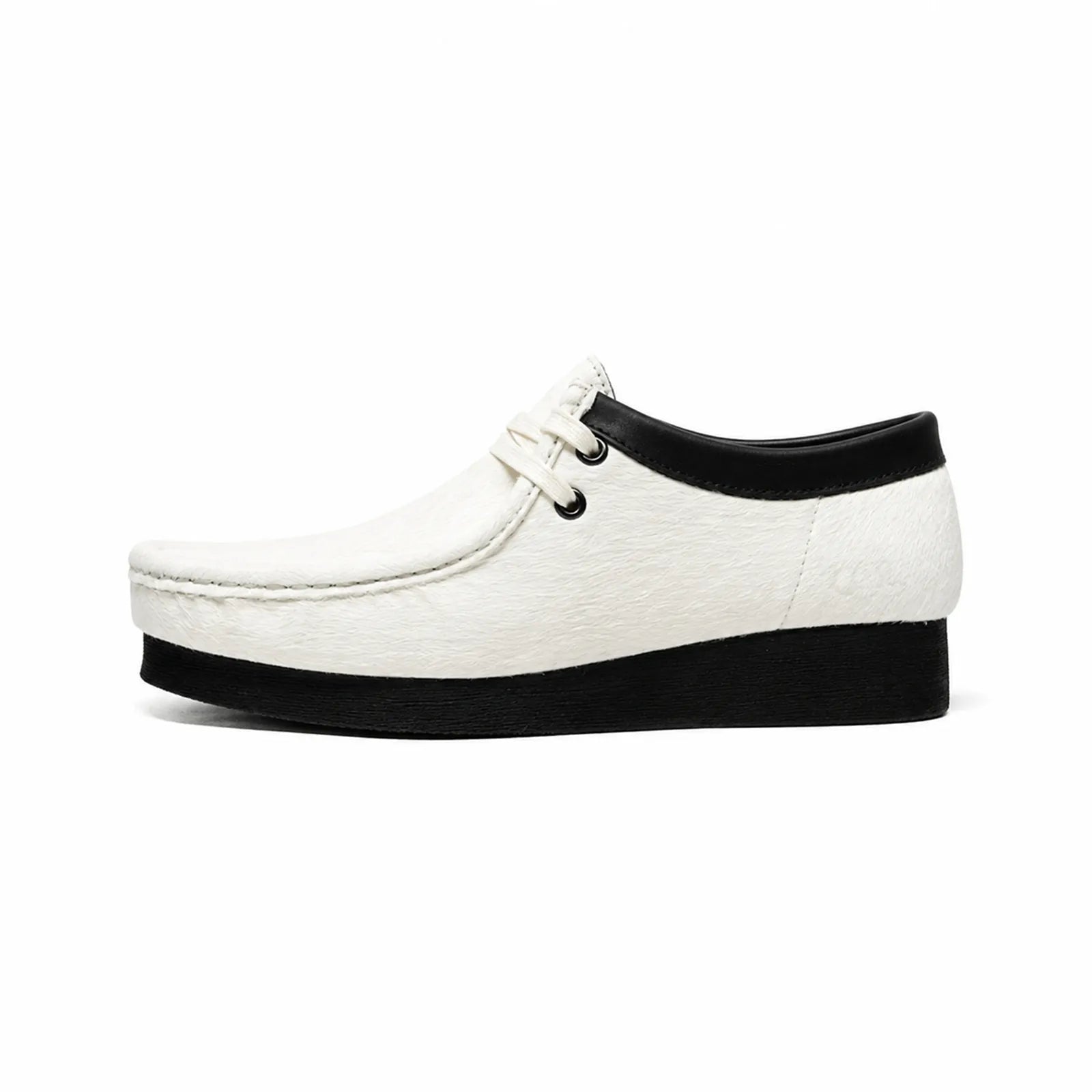 White Wallabee-style lace-up casual shoe with black collar and thick sole