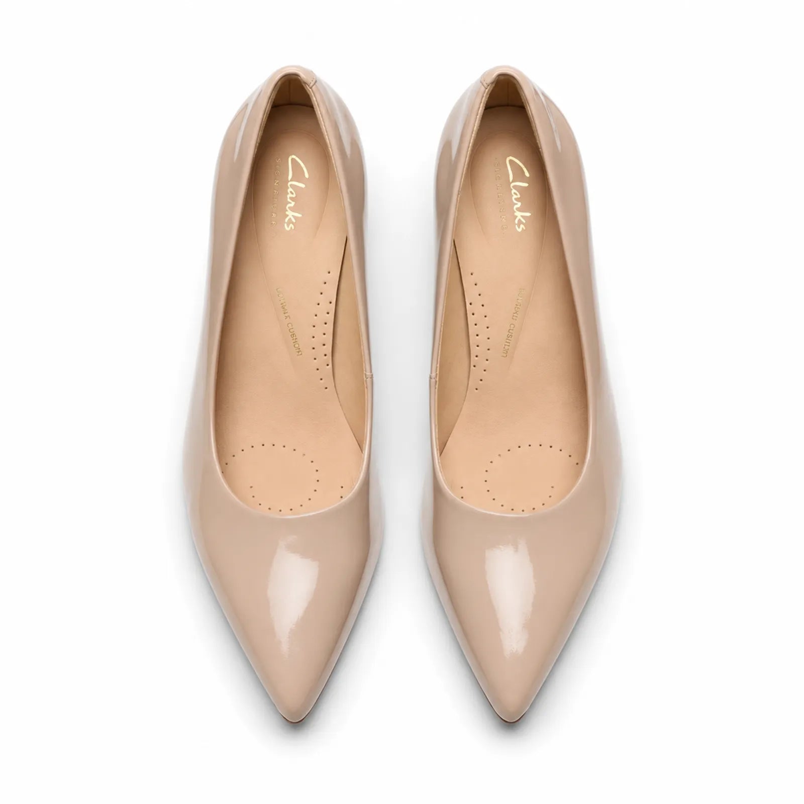 Pair of women's sand patent leather pointed-toe court heels, top view