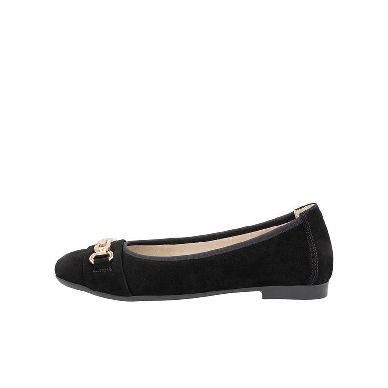 Black flat ballet-style pump with gold buckle strap and rounded toe