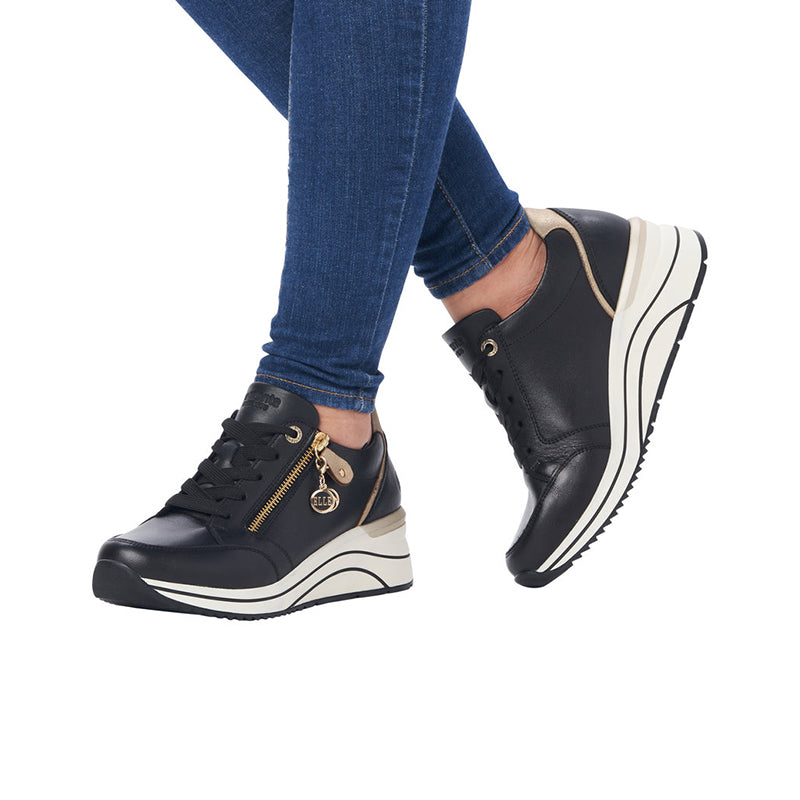 Black women's sneakers with lace-up front, side zip, and thick white sole