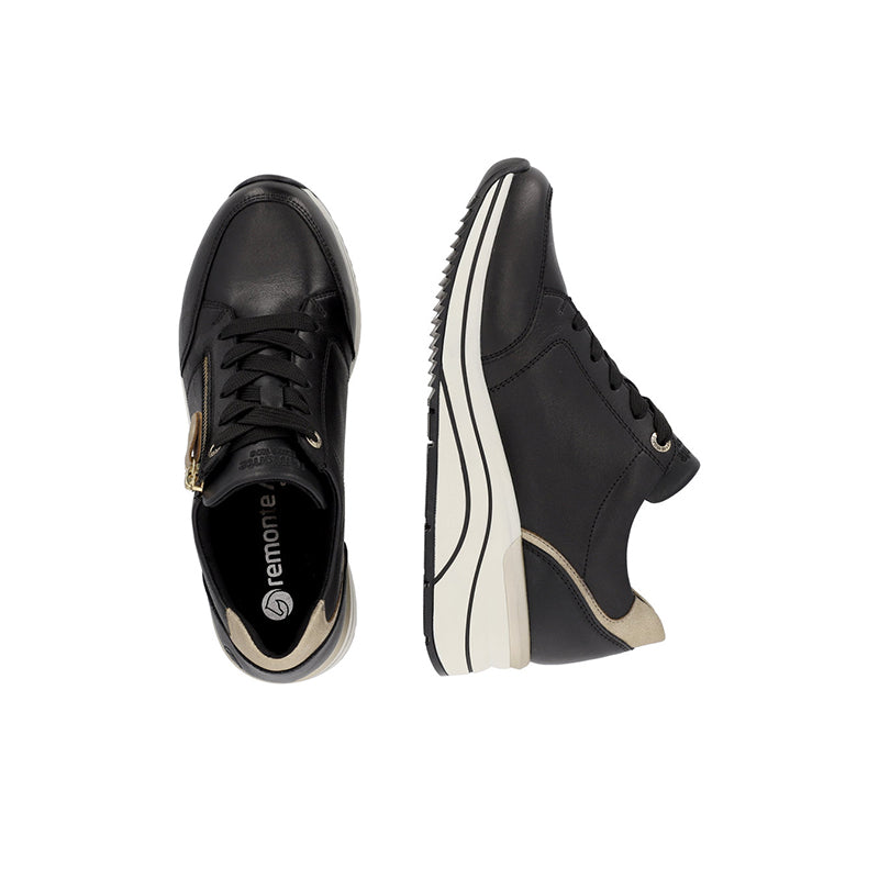 Black women's sneakers with side zip, gold charm, and textured sole