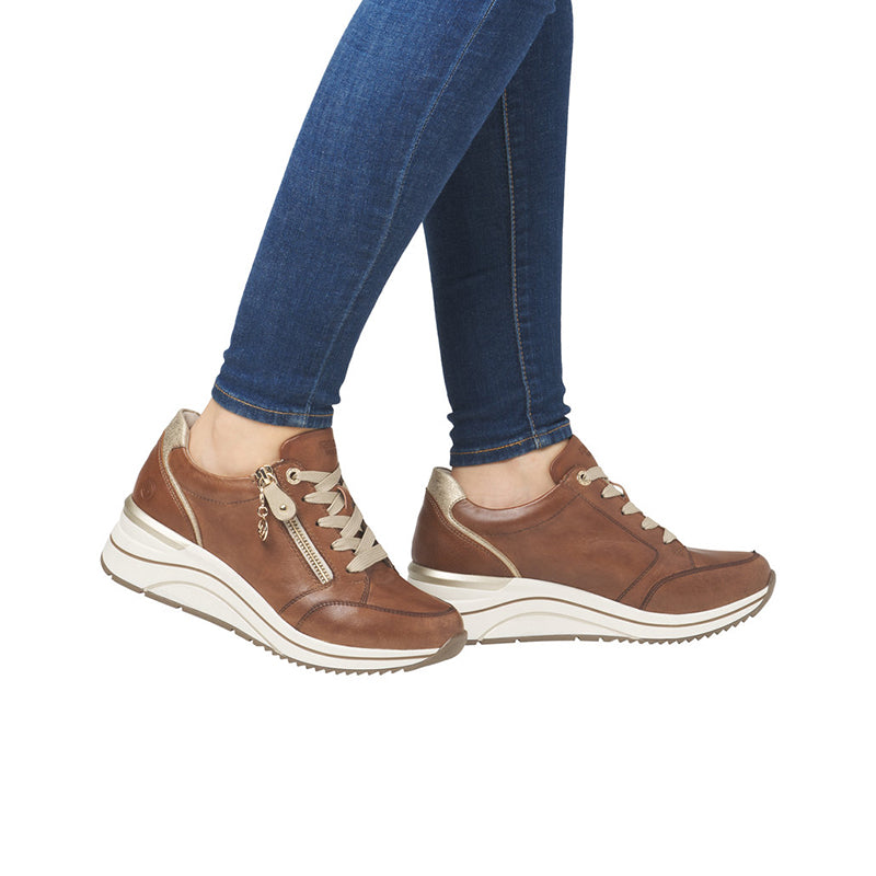 Brown women's sneakers with lace-up front, side zip, and thick white sole