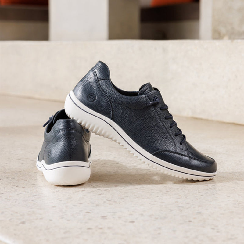 Navy leather-look sneakers with lace-up front and white rubber sole
