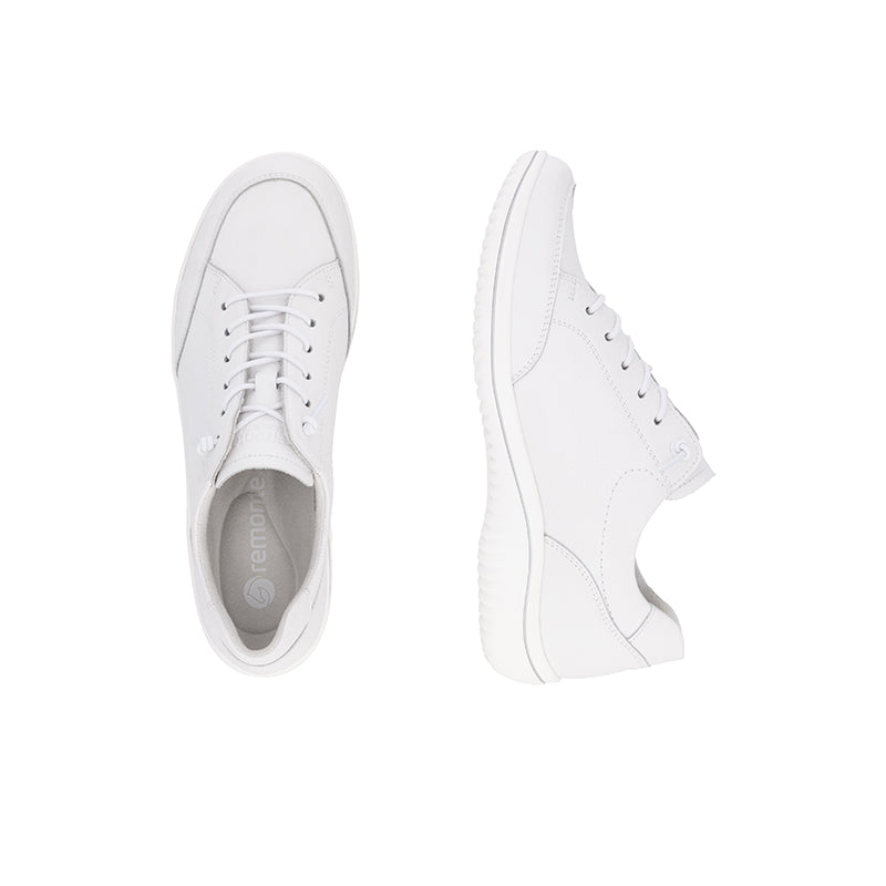 White sneakers pair with lace-up closure and cushioned low-top design