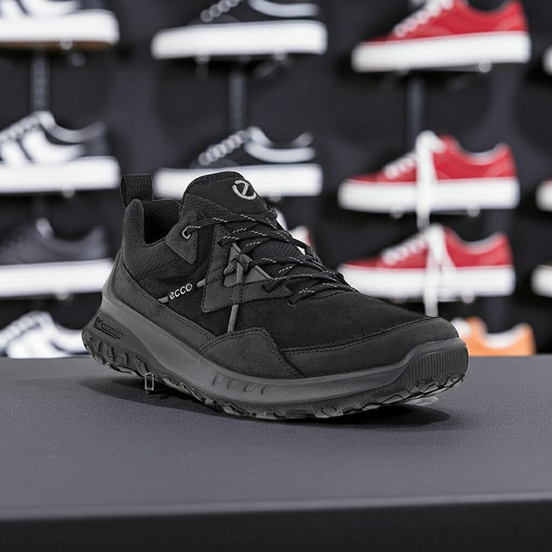 Men's black ECCO sneakers on display, lace-up design with rubber traction sole