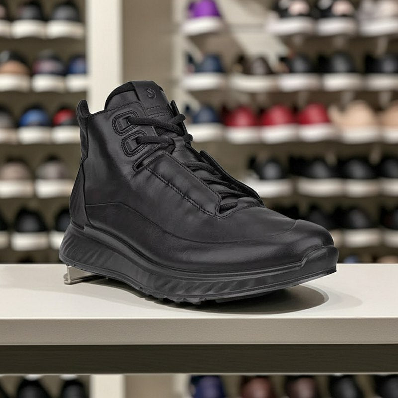 Black men’s high-top sneakers on display with lace-up and layered stitching