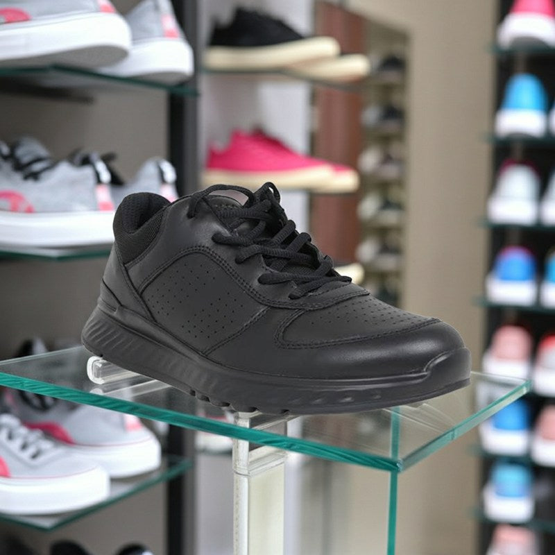 Men's black lace-up sneakers on display shelf
