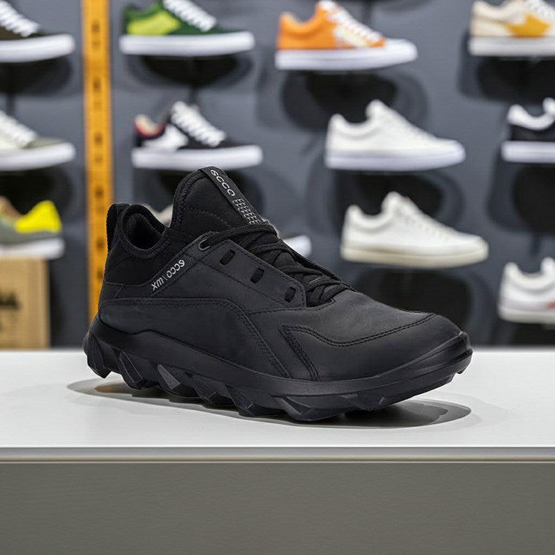 Men's black leather lace-up sneakers with textured midsole and rubber tread
