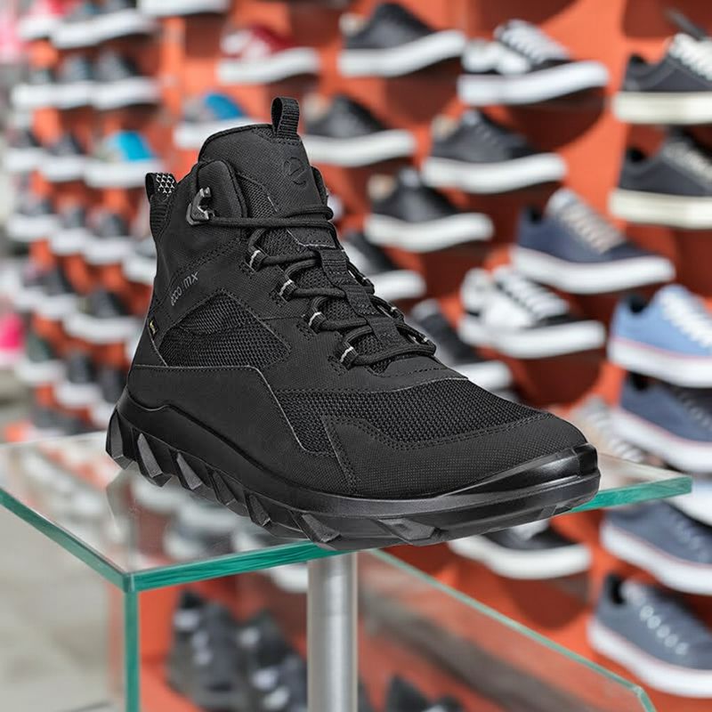 Black high-top lace-up outdoor sneaker with chunky tread