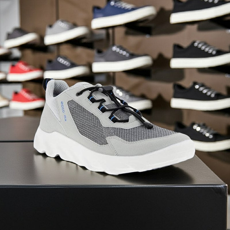Light grey men's lace-up sneaker on display with mesh upper and white sole