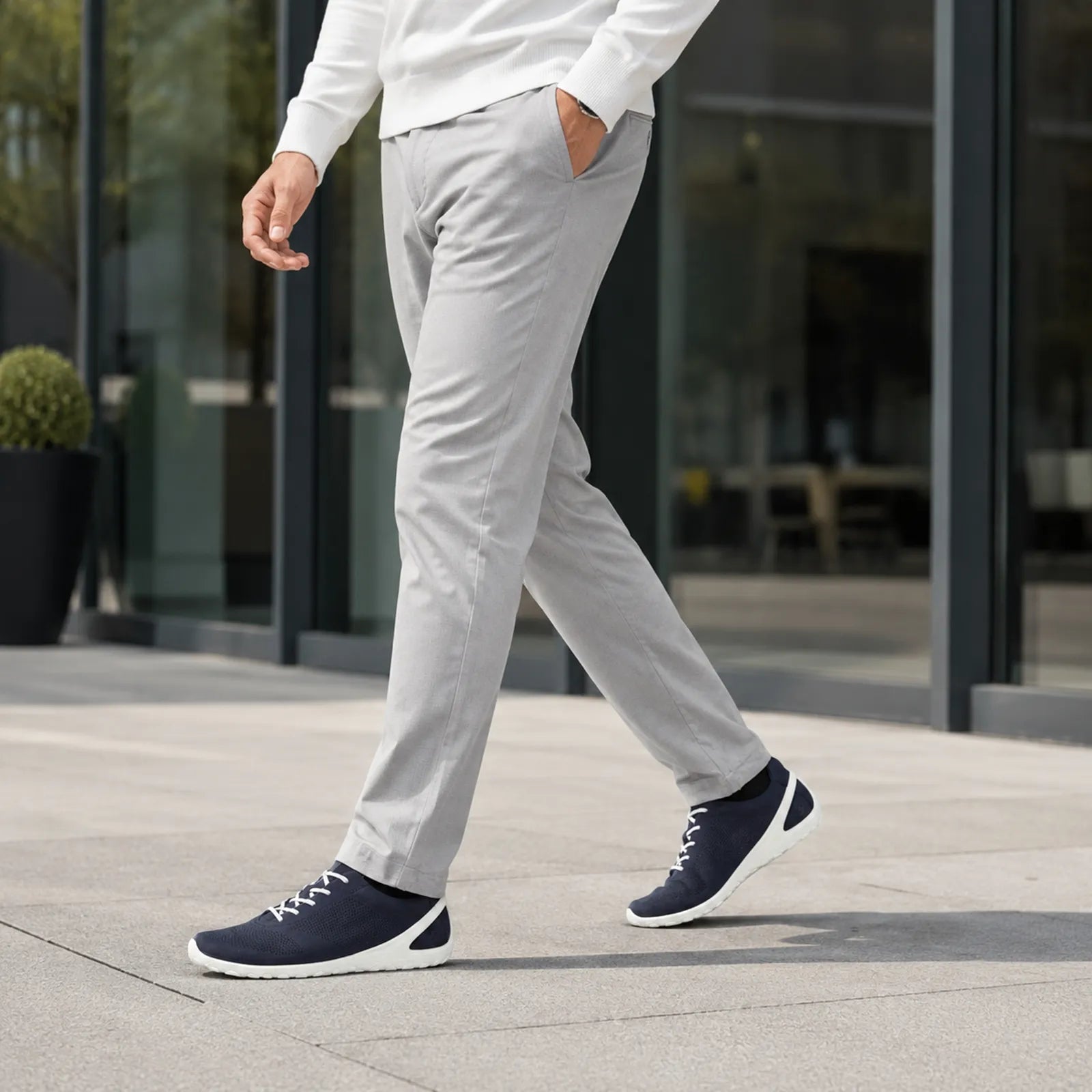 Men's navy lace-up sneakers with perforated toe and white midsole