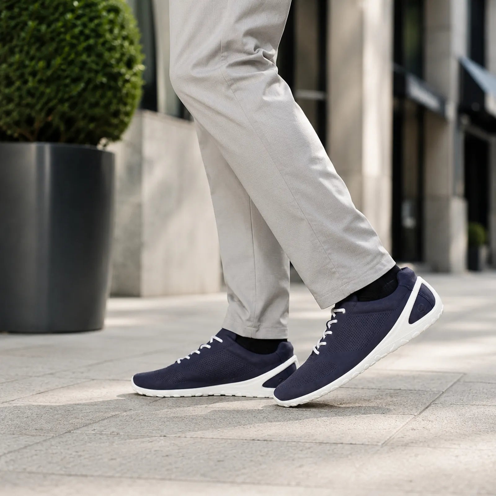 Men's navy lace-up sneakers with white sole and breathable perforated panels