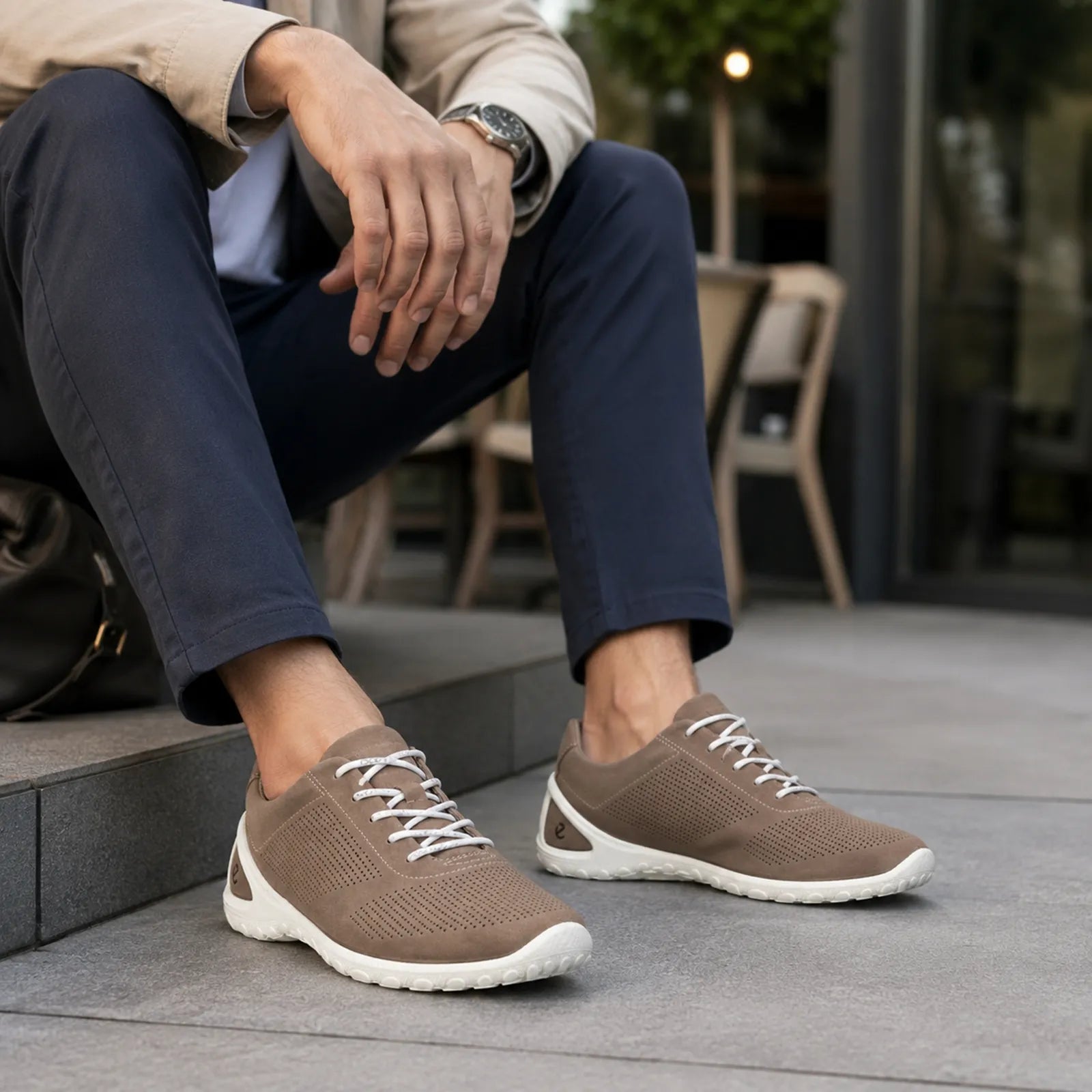 Men's tan lace-up sneakers with white rubber sole and breathable perforated uppers