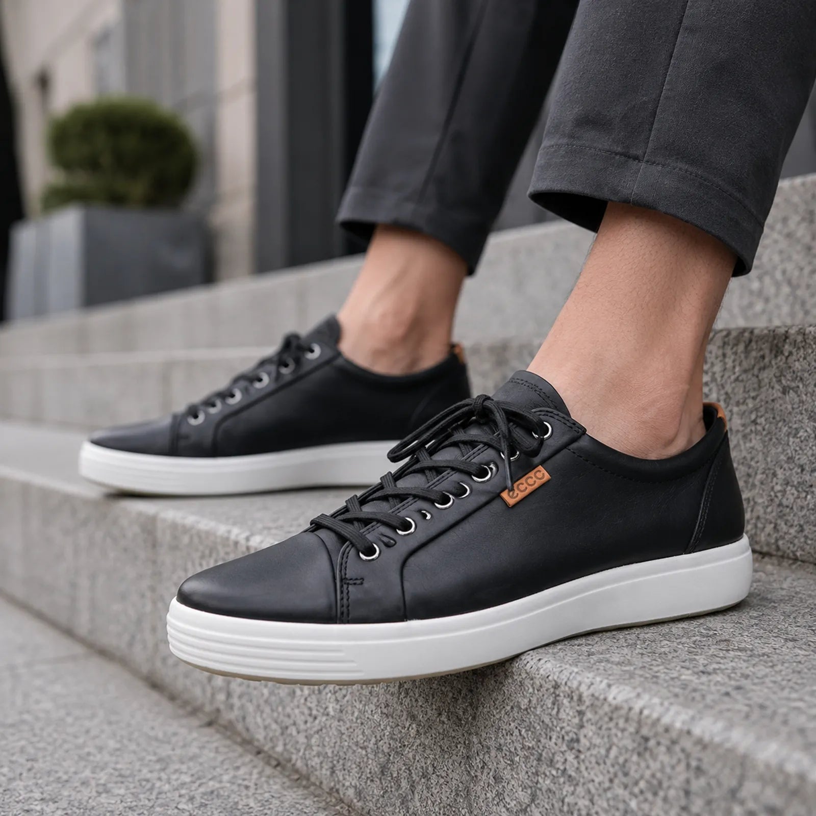 Men's black leather lace-up sneakers with ECCO badge and white sole