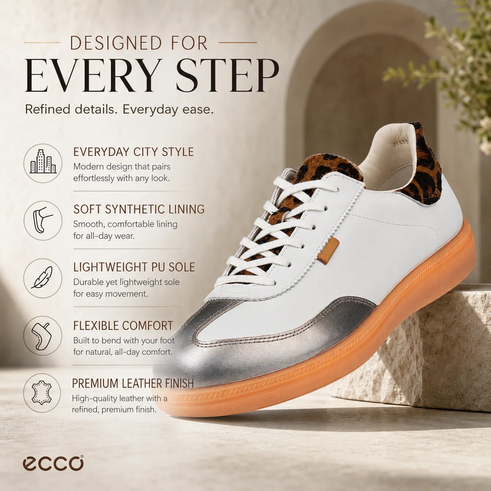 Women's lace-up sneaker in white and metallic gray, orange sole, leopard collar