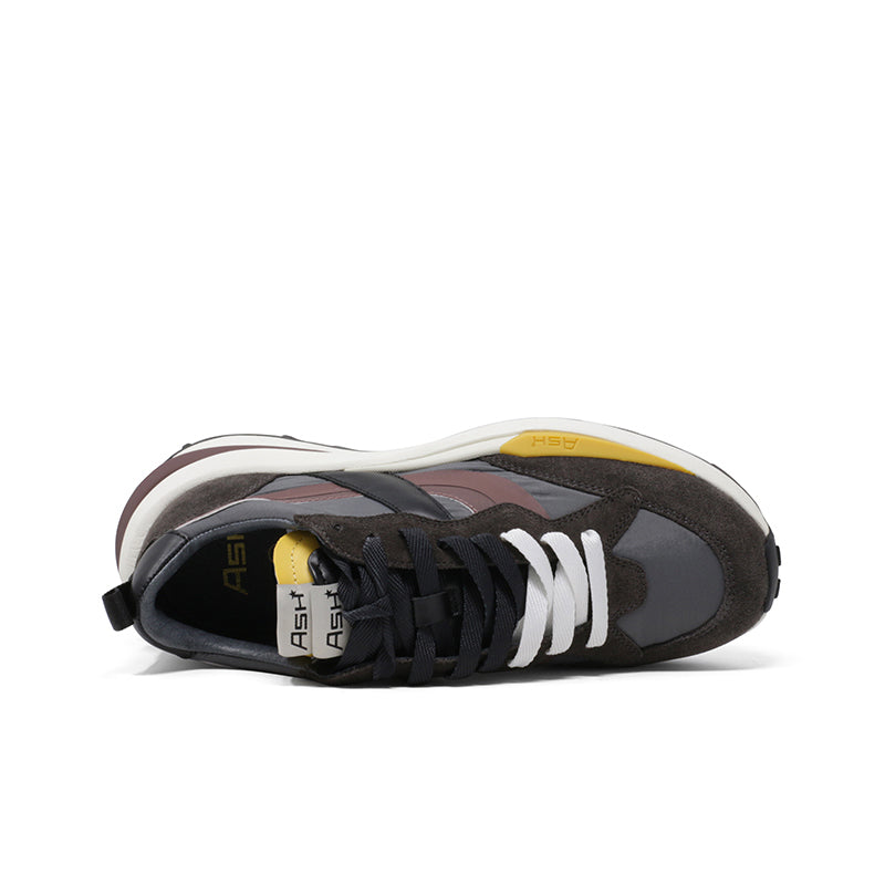 Women trainers toe and heel view, dark brown upper with black laces and branded tongue