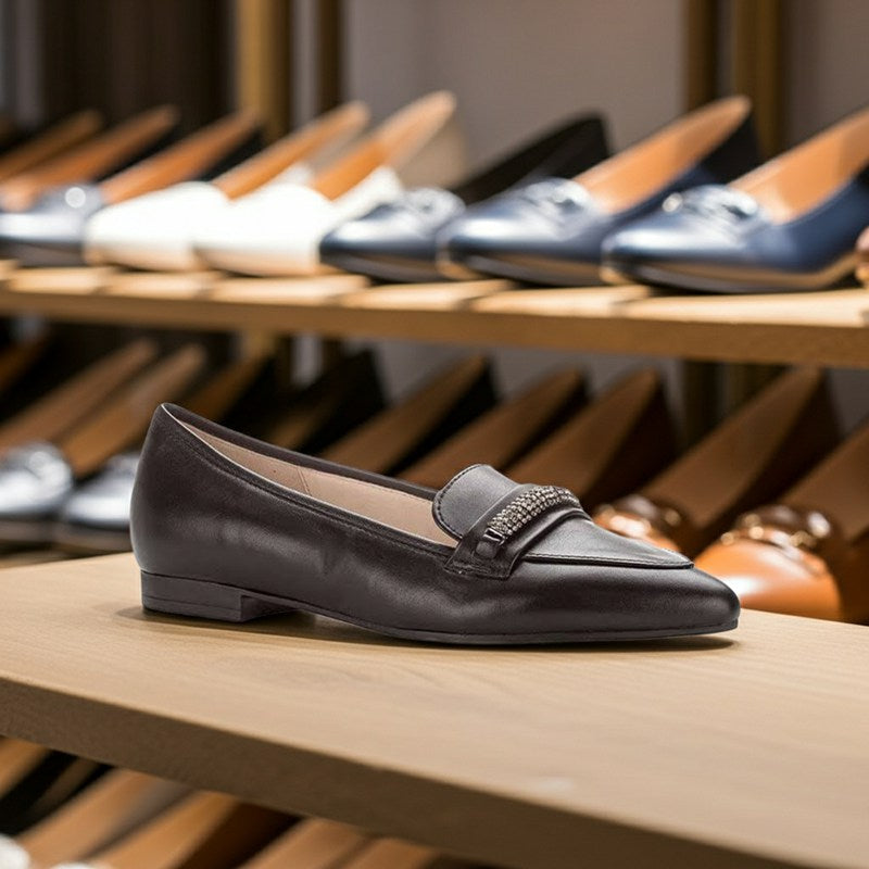 Black leather ballerina flats with jeweled strap detail and low heel