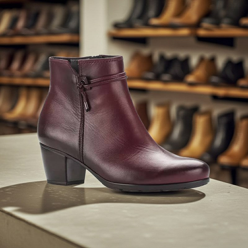 Women¡¯s burgundy leather heeled ankle boots with side zip, strap, and square block heel