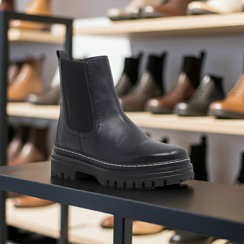 Black leather ankle boots with side elastic gore and thick treaded sole