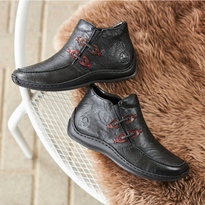 Black leather-look lace-up ankle boots with red eyelets and low profile sole