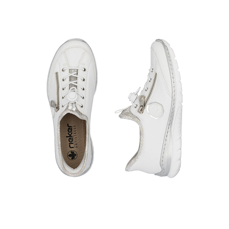 Pair of white women's slip-on sneakers with lace-up front and side emblem