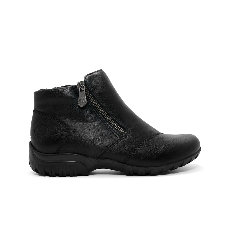 Black women’s ankle boot with side zipper, stitched panels, and cushioned outsole