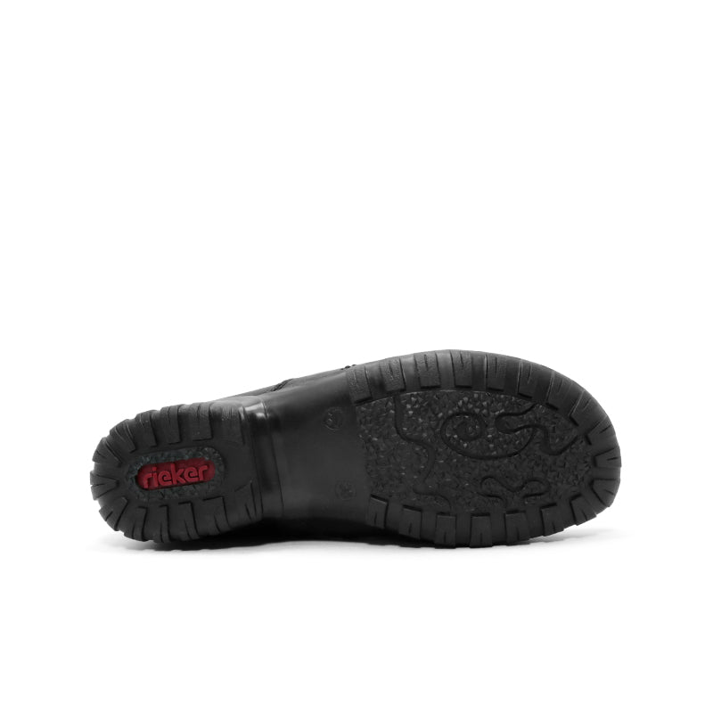 Black boot outsole with deep tread and Rieker logo