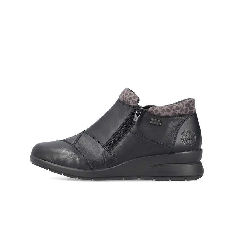 Black ankle boots with side zip, textured panels, leopard-print lining