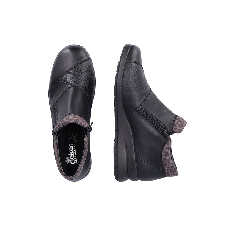 Pair of black ankle boots with side zipper and leopard-print inner cuff