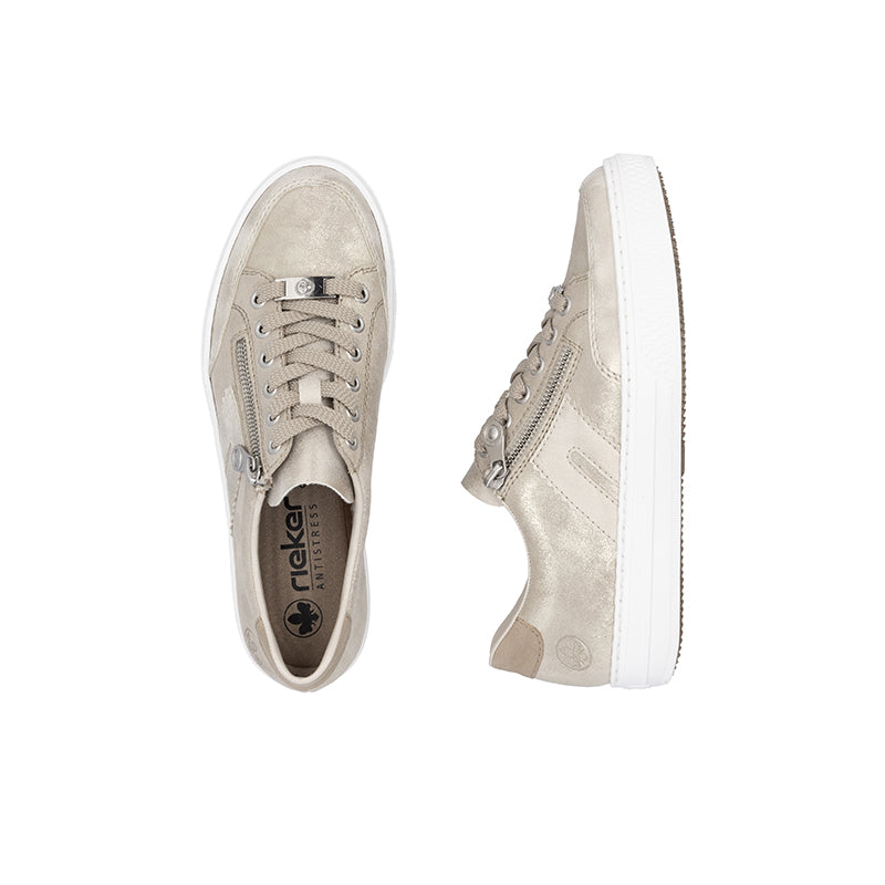 Beige low-top sneakers with lace-up, side zipper, and white sole