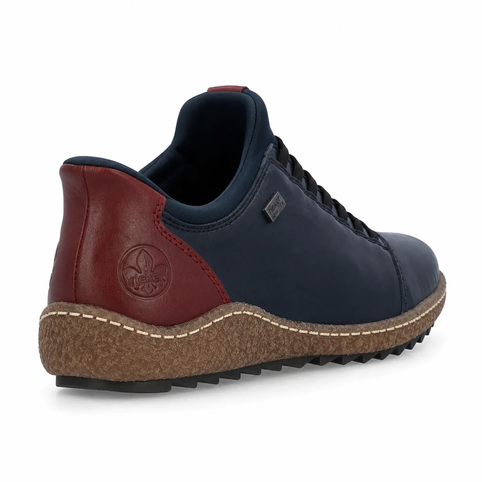 Rieker women's blue slip on shoes side angle view showing elasticated fit and contrast heel detail