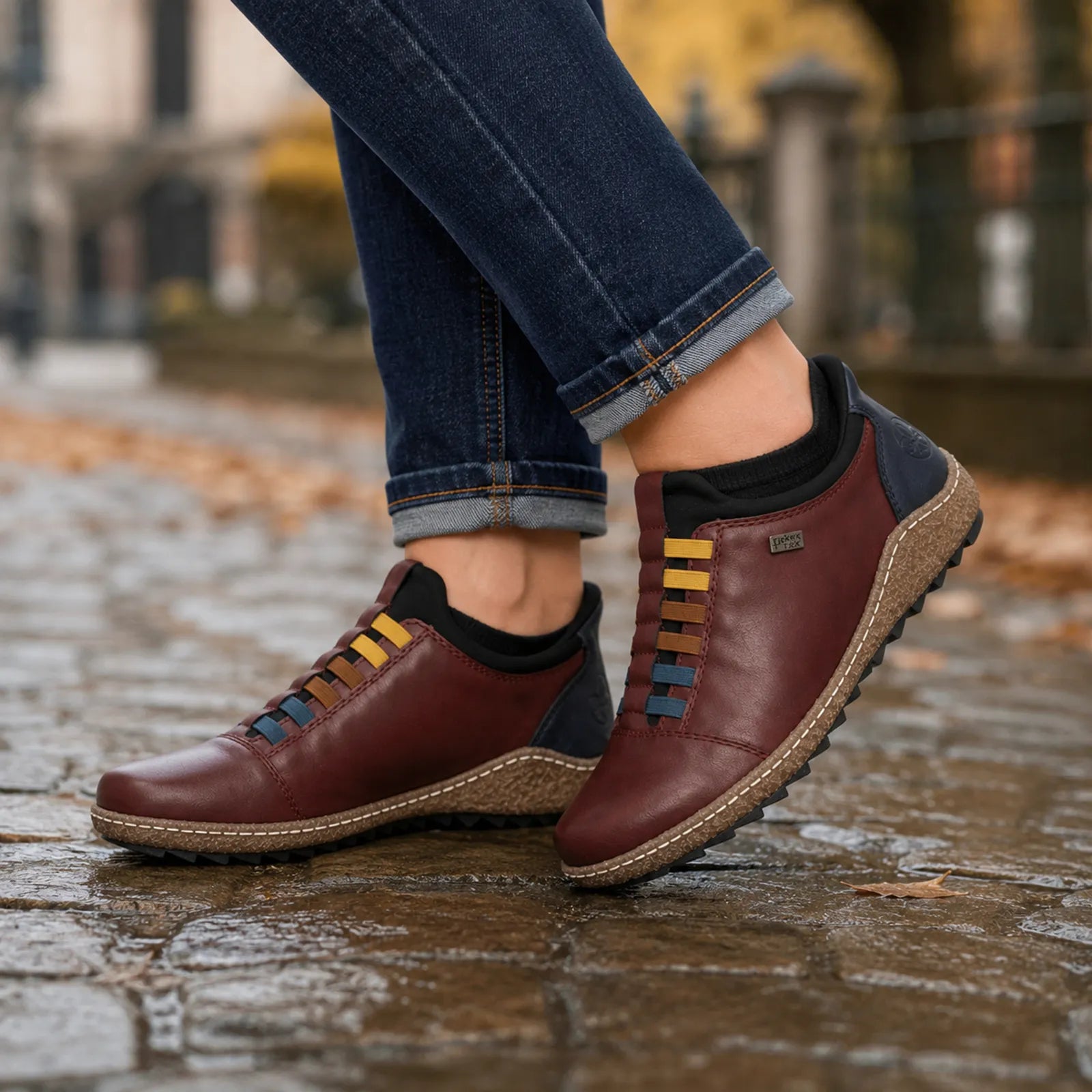 Rieker women's red slip on shoes worn for casual walking and everyday winter comfort
