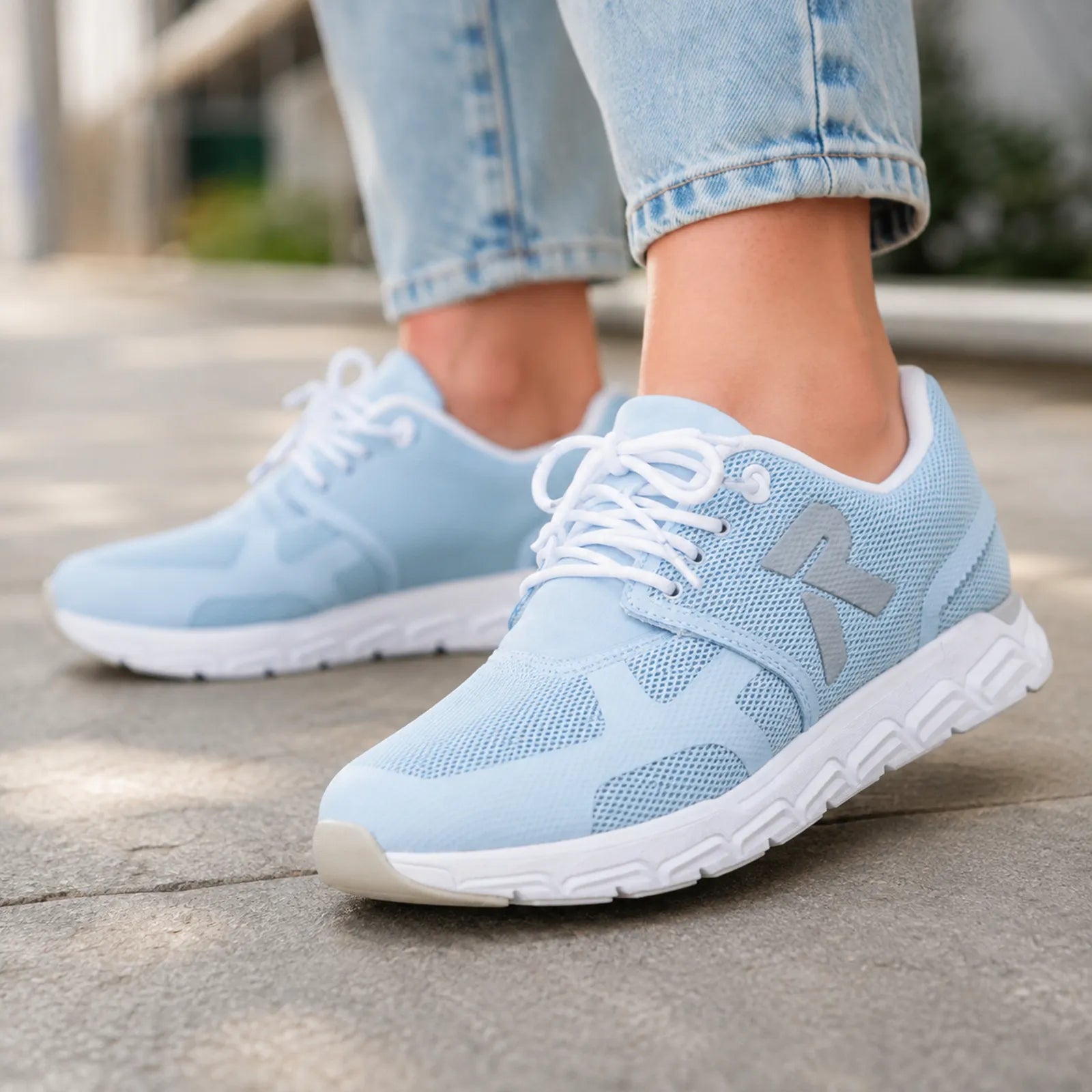 Light blue mesh lace-up sneakers with side logo accents and cushioned sole