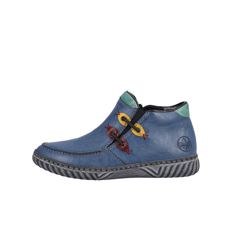 Women’s blue mid boots with lace-up detail, green ankle tab, and textured outsole