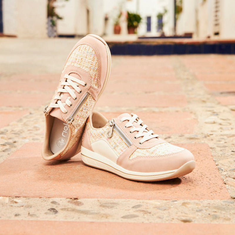 Pink lace-up sneaker with textured upper and low-profile sole