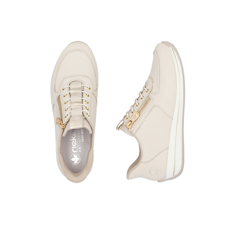 Beige sneakers pair with lace-up front and side zipper on low sole