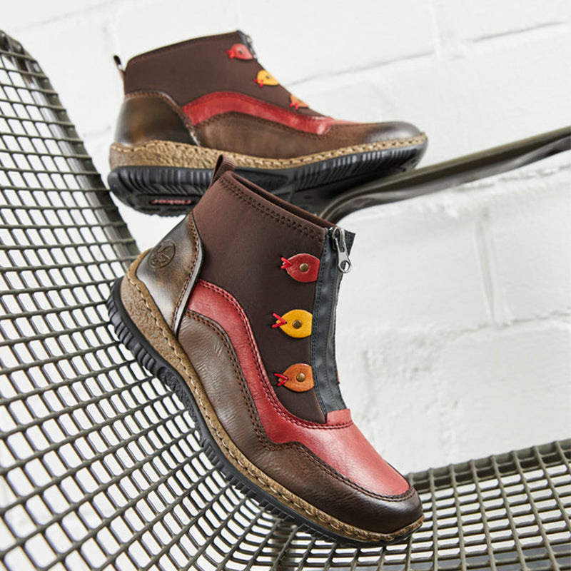 Pair of multicolour ankle boots with elastic side panels and textured rubber sole