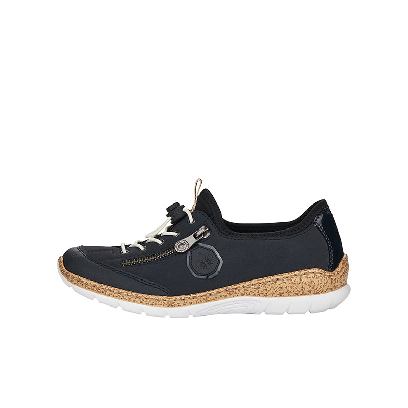 Women's navy sneakers with circular patch detail and tan speckled sole