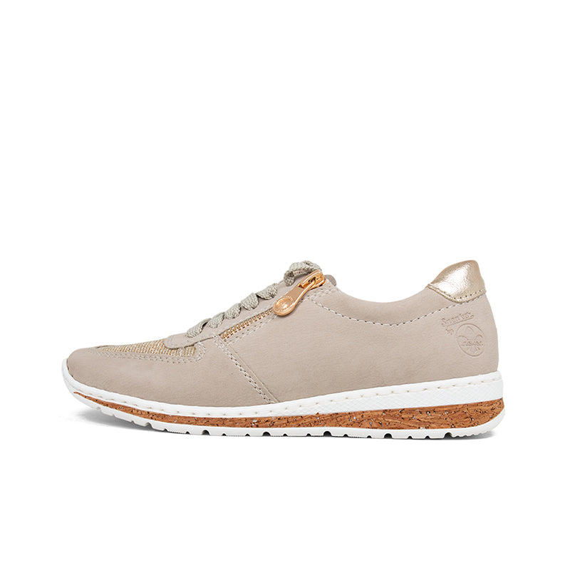 Light beige lace-up sneakers with tan rubber sole and gold accent eyelets