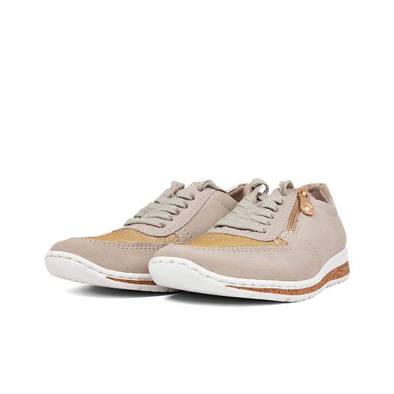 Pair of light beige lace-up sneakers with tan rubber sole