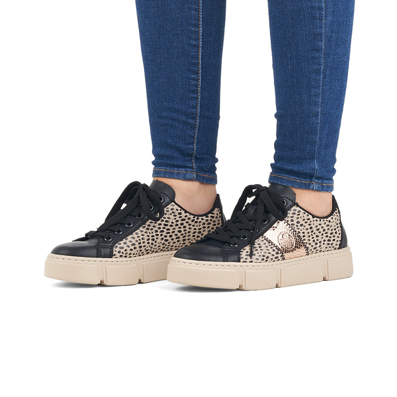 Pair of lace-up leather sneakers with leopard-print beige uppers and black soles