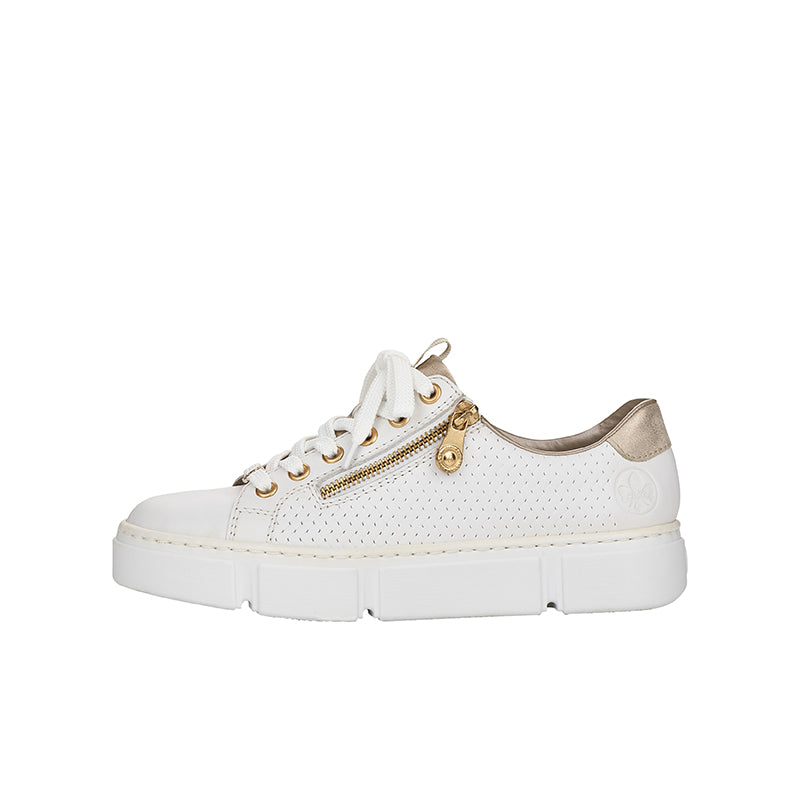 White low-top sneaker side view with gold eyelet hardware and chunky platform sole