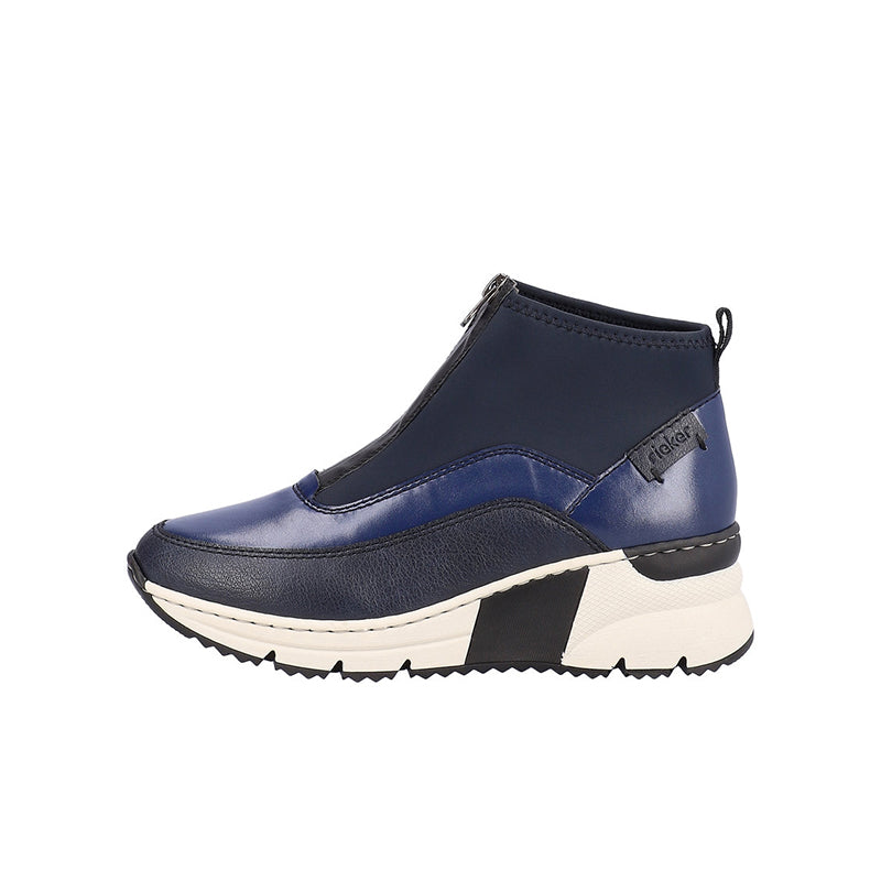 Navy blue ankle boots with side zip, contrast panel, and white chunky sole