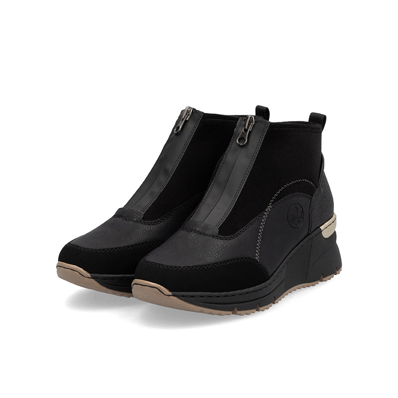 Pair of women's black ankle boots with side zippers and cushioned wedge sole