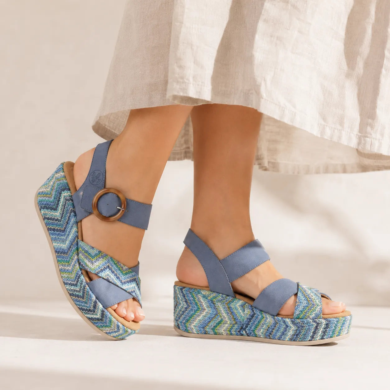 Women¡¯s blue platform wedge sandals with cross straps and round metal buckle