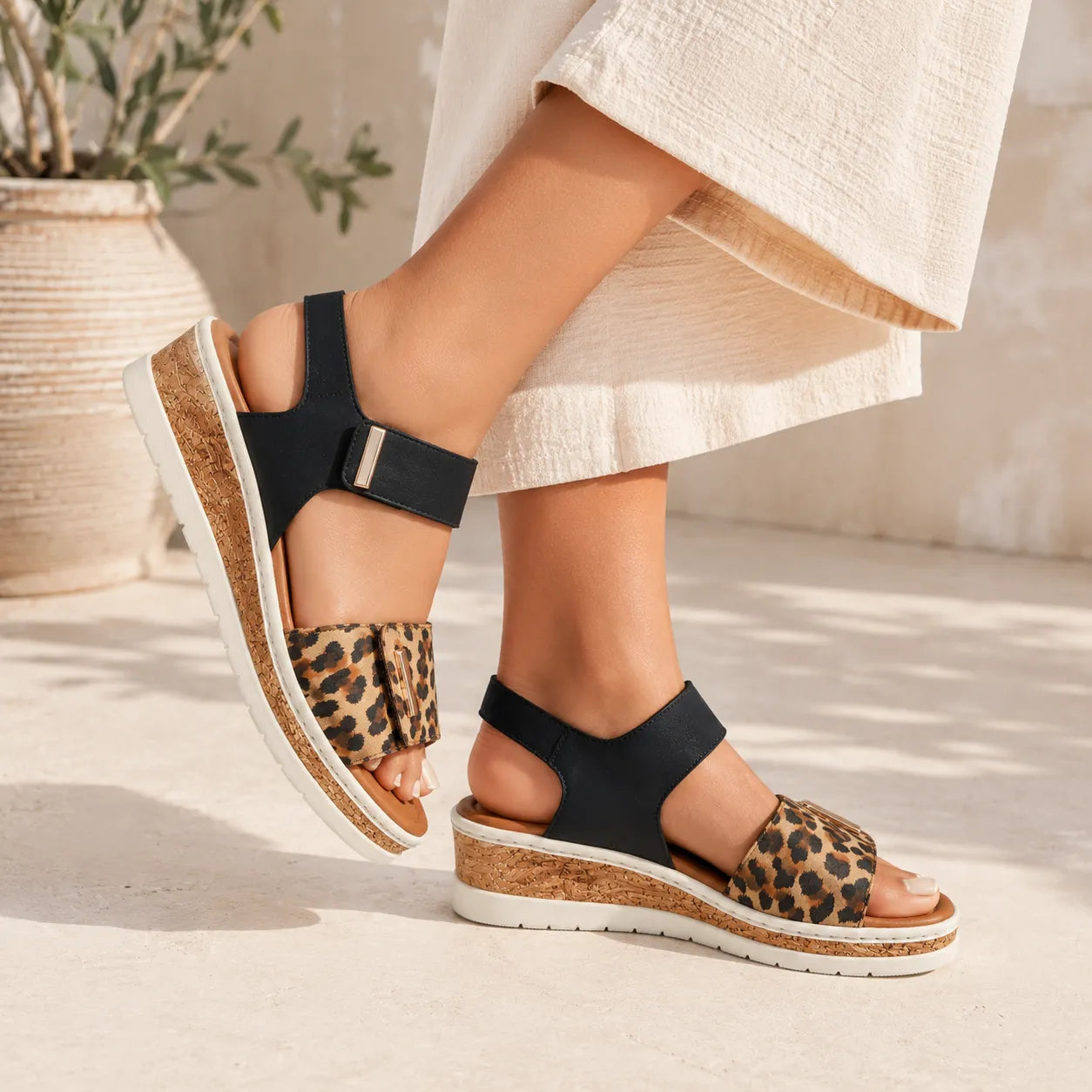 Rieker women's strap sandals black leopard leather comfort width V4181-00 Lisa, on-foot view with outfit