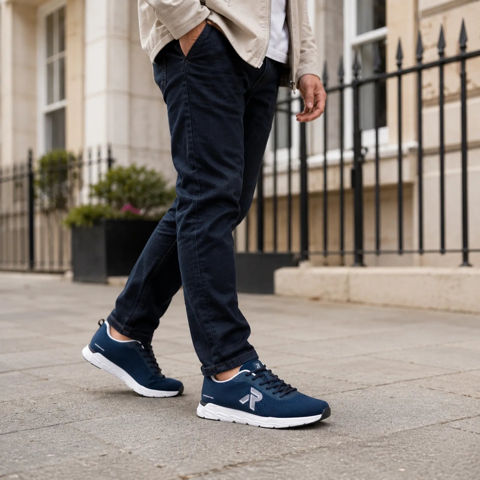 Men's blue lace-up sneakers with knit upper and white cushioned sole
